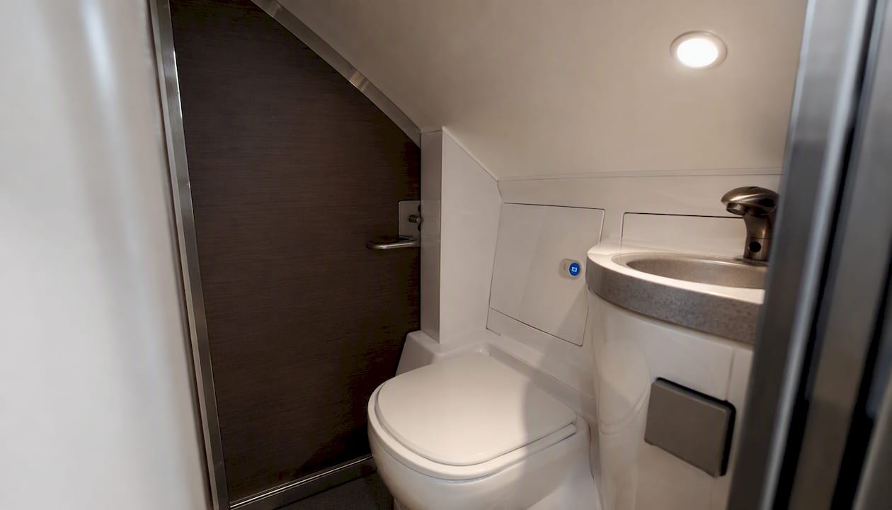 Interior view of small charter bus restroom
