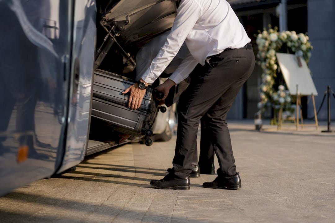 Wedding shuttle luggage loading hands