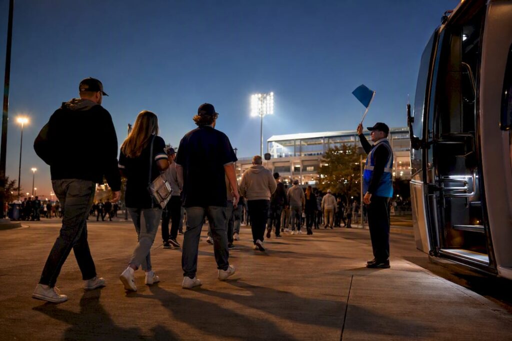 Fans approaching a game day shuttle