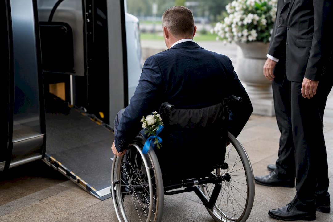 Wheelchair user boarding wedding transportation