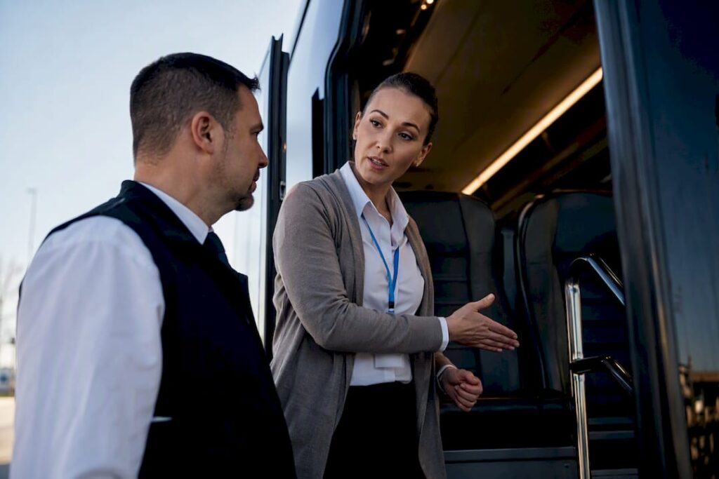 Event lead conducting charter bus safety briefing