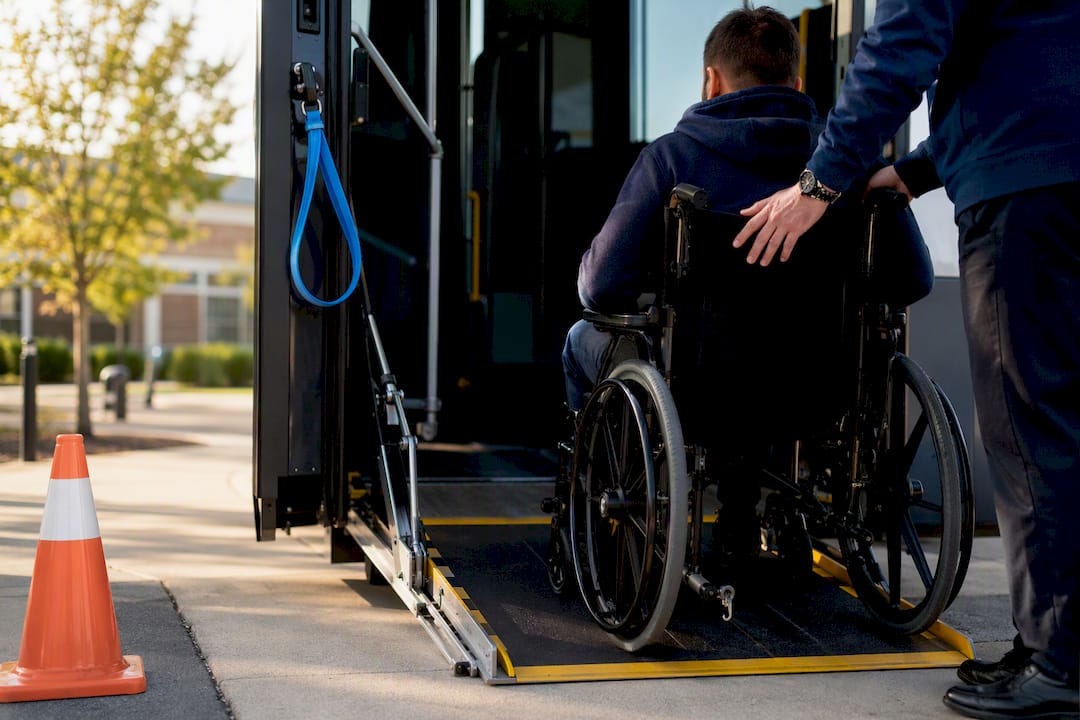 Wheelchair approaching accessible vehicle ramp
