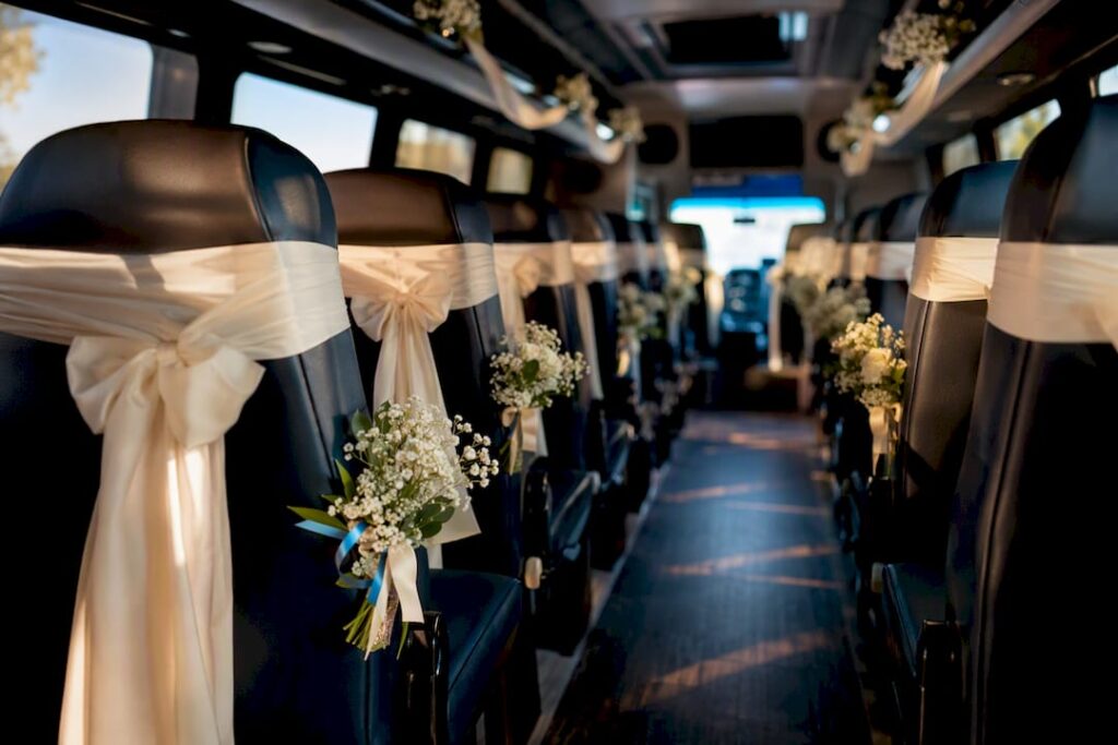 Decorated wedding shuttle interior with ribbons