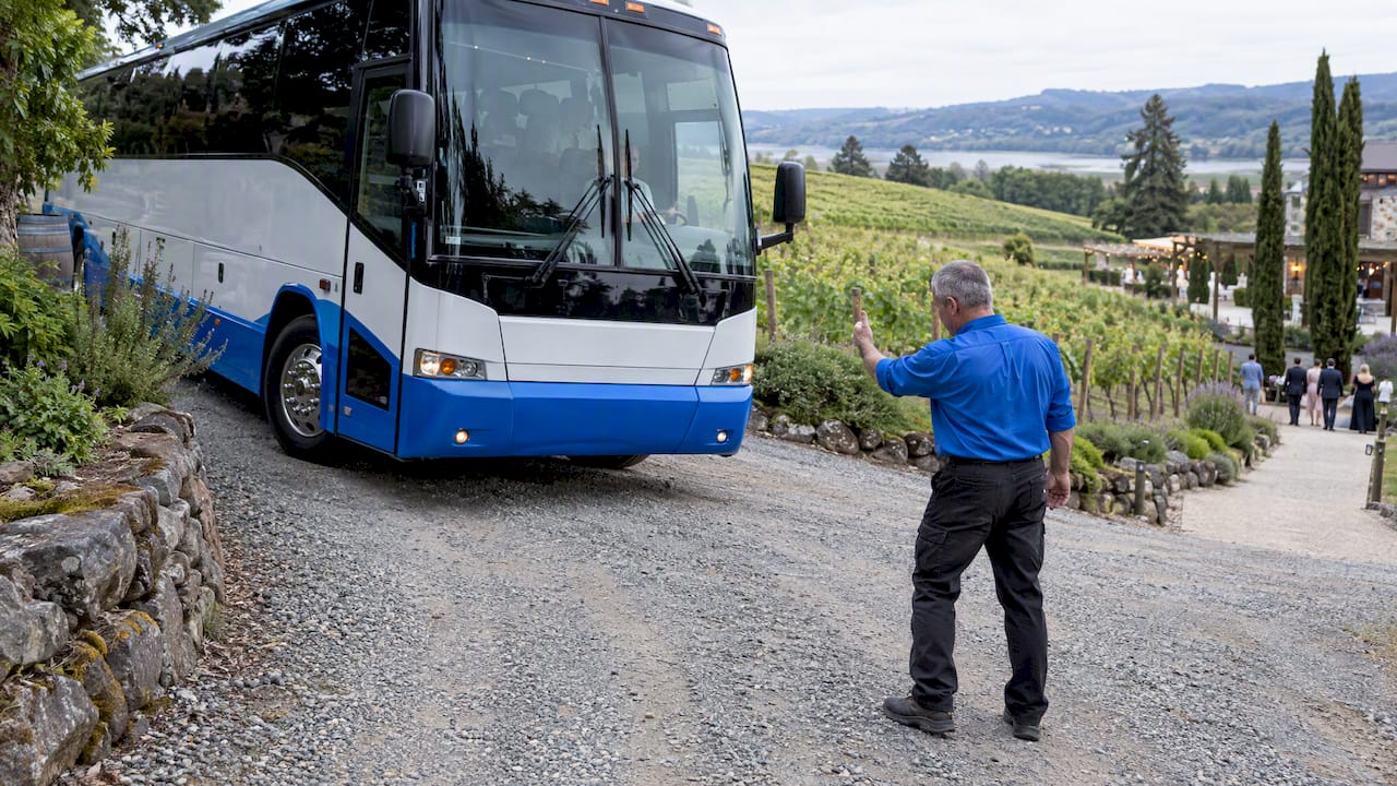 Wedding shuttle positioning on vineyard gravel lane